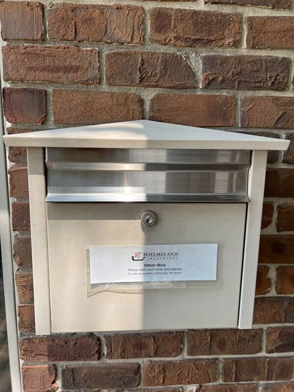 Payment dropbox on brick wall